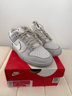 Nike Men’s Dunk Low Low-Top Sneakers in Light Gray with White Swoosh